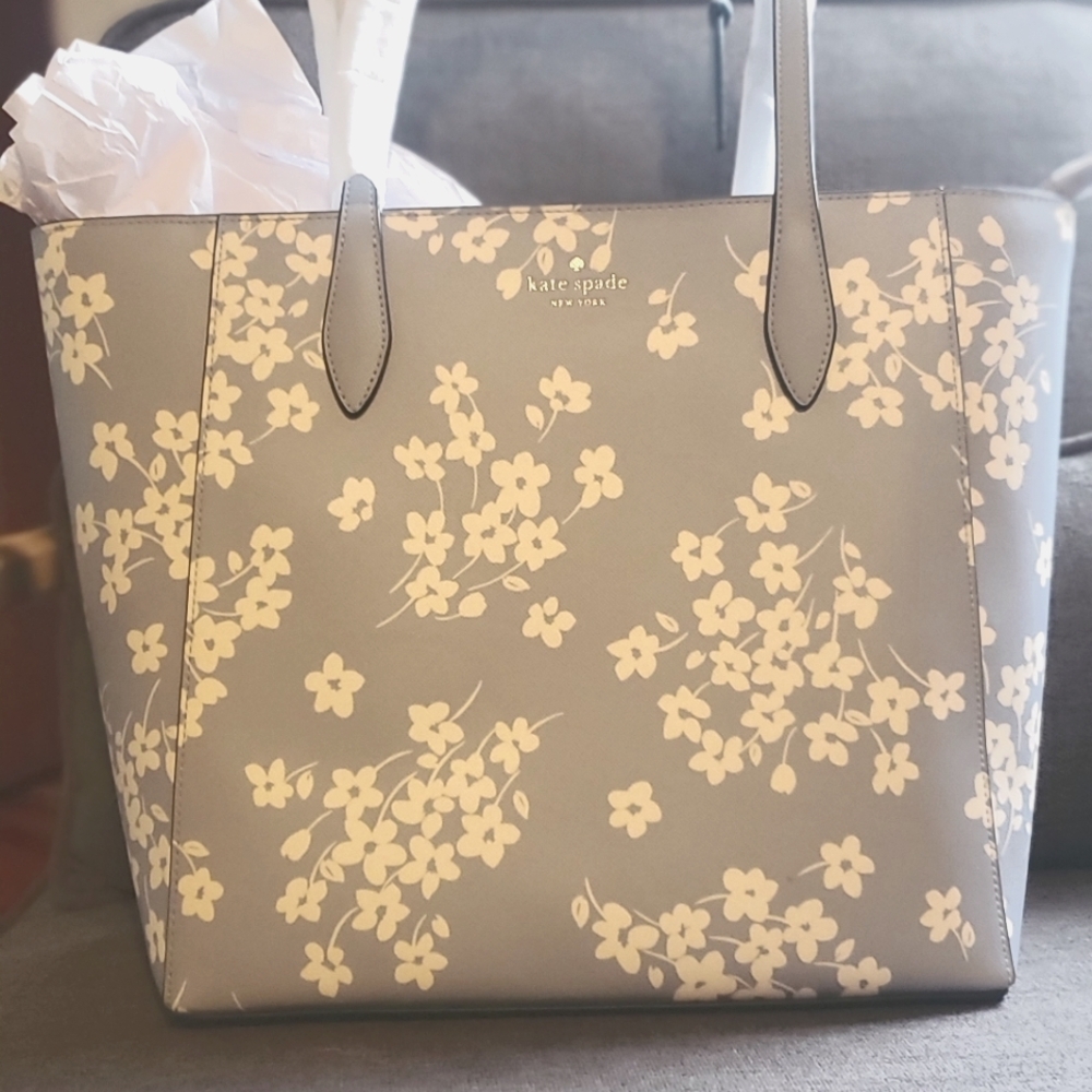 Med Kate Spade Light blue tote with white flowers.